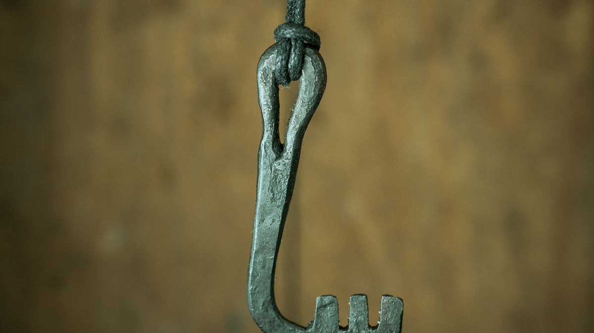 blacksmith making a viking era key and viking lock