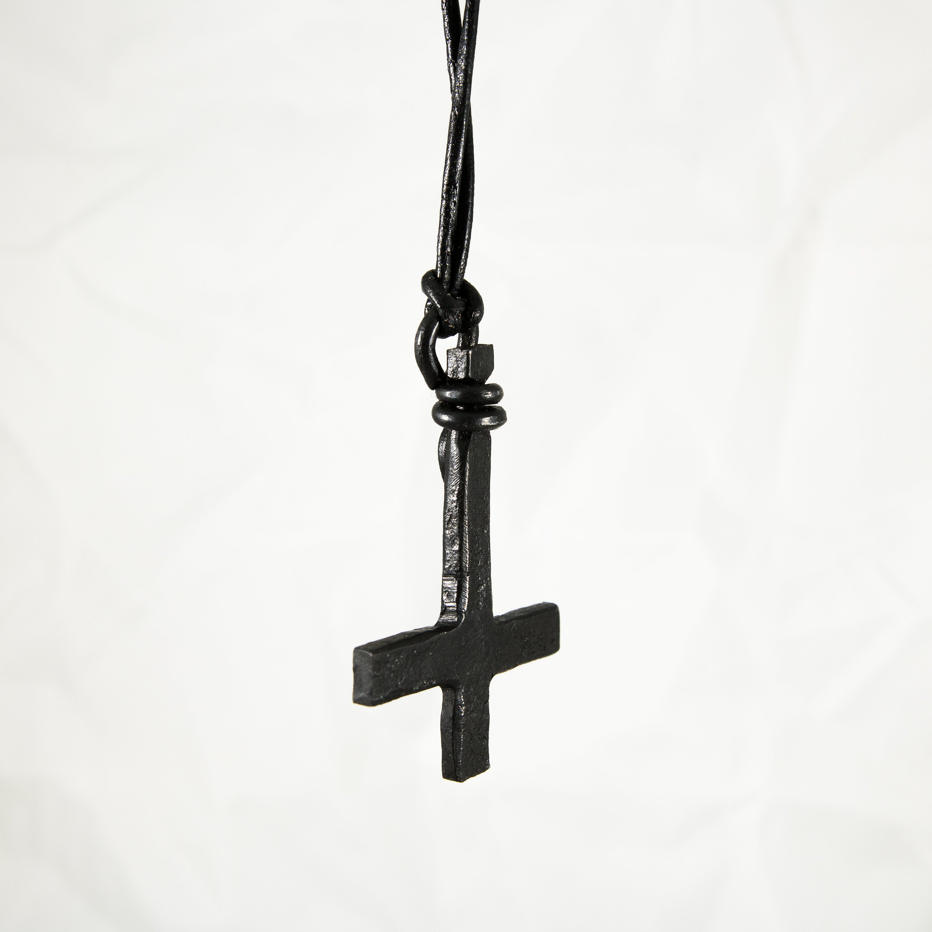 Inverted cross pendant