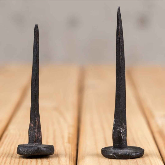two hand forged nails