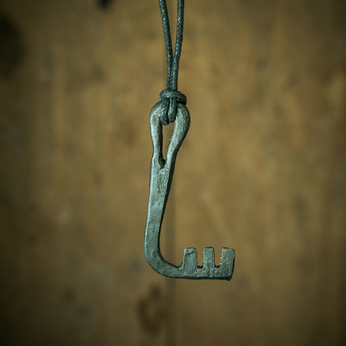 blacksmith making a viking era key and viking lock