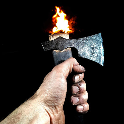 A photo of a skilled bushcraft enthusiast using an authentic hand-forged Viking axe to chop firewood. The axe is being used with precision and control, producing clean, well-placed cuts.