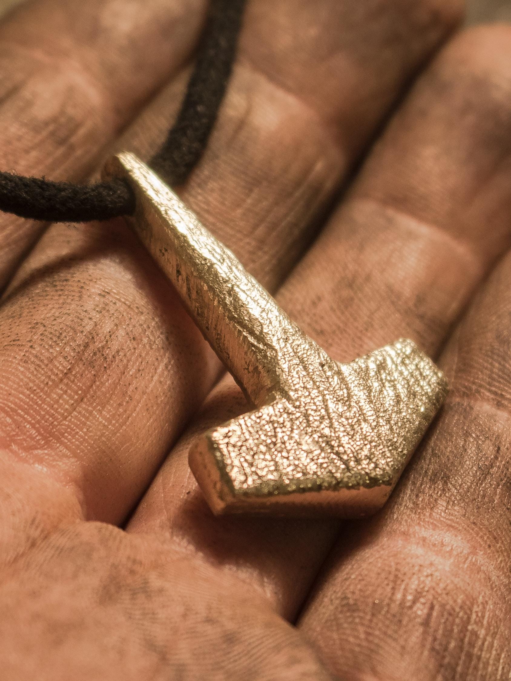 close up on bronze mjolnir pendant